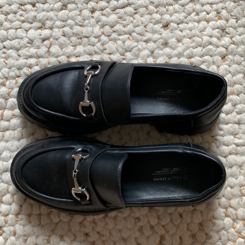 Black loafer with silver chain detail